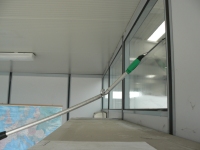 Window cleaning with extension pole and angle adaptor